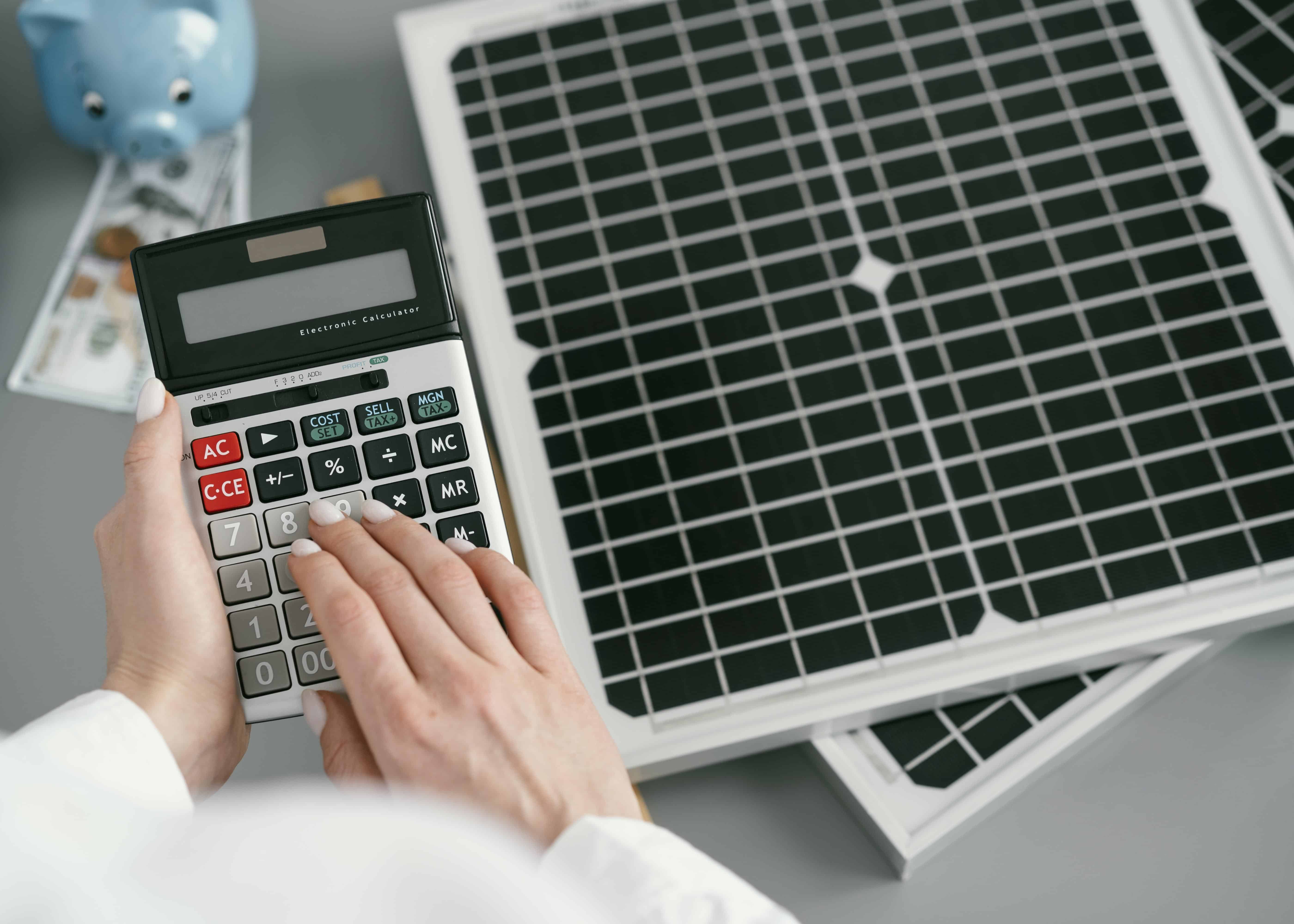 Close Up Hand Typing Calculator